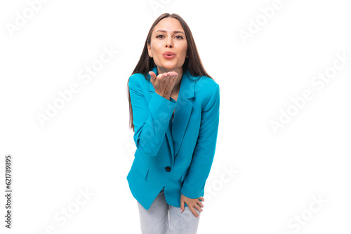 young confident pretty brunette leader woman with long hair in a blue jacket © Ivan Traimak