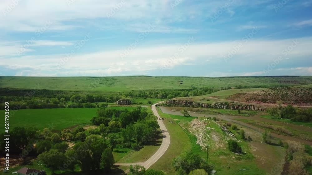 Aerial Forward Shot Of Pickup Truck Leading Towards Bridge Over River, Drone Flying Over Landscape Against Sky - Billings, Montana Aerial Forward Shot Of Pickup Truck Leading Towards Bridge Over River, Drone Flying Over Landscape Against Sky - Billings, Montana