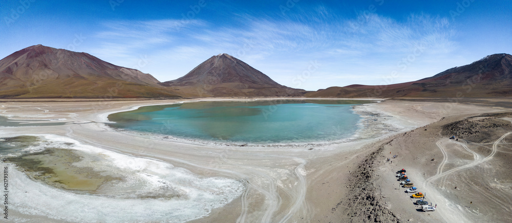 Naklejka premium Aerial view of the picturesque Laguna Verde with Licancabur Volcano, just one natural sight while traveling the scenic lagoon route through the Bolivian Altiplano - Panorama 