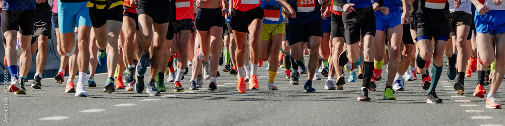 legs group of runners men and women run marathon race, panoramic view sports event