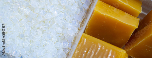Hot melt adhesive in food labeling and packaging. Thermoplastic polymers. Non toxic hot melt glue block and hot melt adhesive pastilles or pellets. Chemical business industry. Packaging solutions.