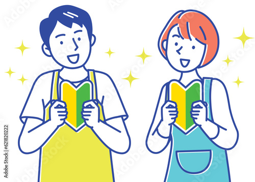 初心者マークを持つエプロン姿の若い男女