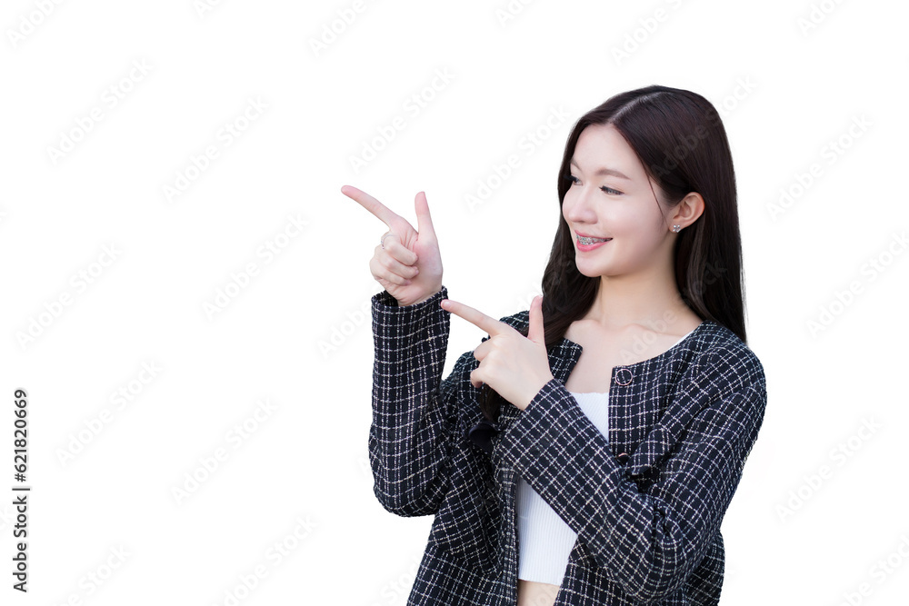 Asian professional working woman who wears black suit with braces on teeth is pointing hand to present something while isolated on white background. Asian professional working woman who wears black suit with braces on teeth is pointing hand to present something while isolated on white background.