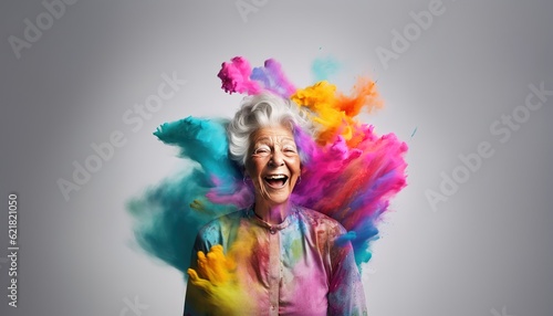 Happy old woman smiling in a cloud of colorful smoke, color explosion, holi, age-positivity, against ageism, having fun, over 50, colors, party, peace, inclusive, freedom. Generative AI. © Flying Fred