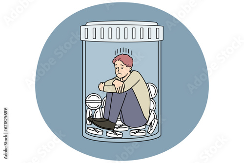 Unhappy man sitting in bottle with medicines suffer from depression or nervous breakdown. Upset stressed male struggle with drug and medication addiction. Vector illustration.