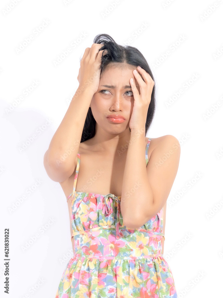 Portrait young Asian woman used hands to head grotesquely on her hair with the teeth bite because of the stress, copy space on white background Portrait young Asian woman used hands to head grotesquely on her hair with the teeth bite because of the stress, copy space on white background