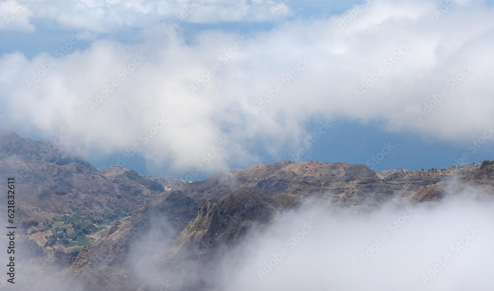 views thrugh the clouds in Ribeira da Torre, Santo Antão, Cape Verde; clouds between the mountains, Atlantic ocean