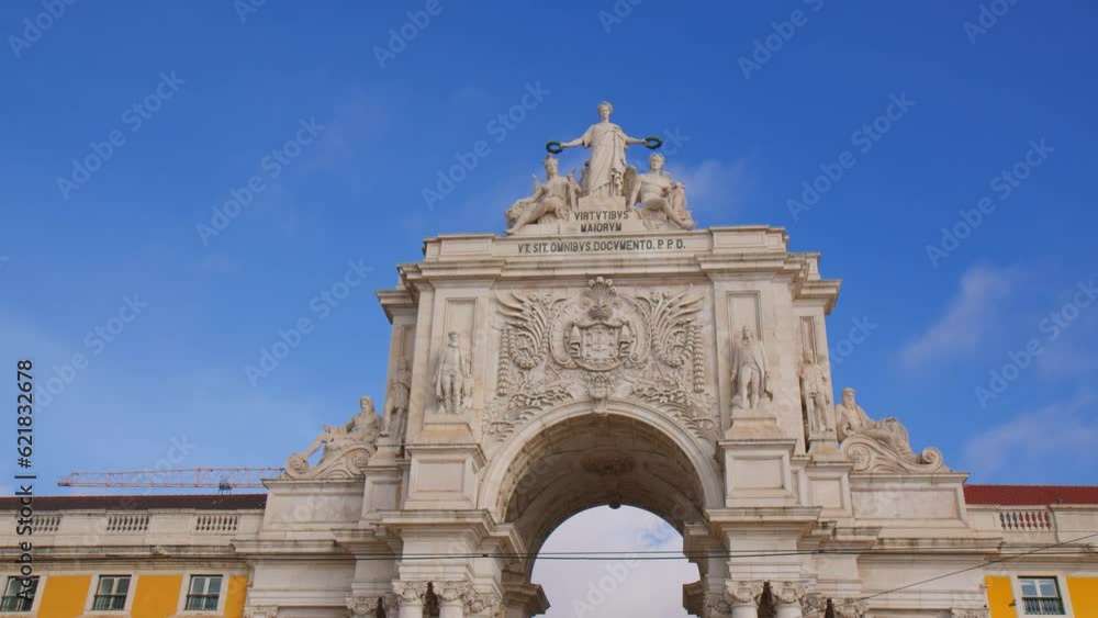 The Rua Augusta Arch Against Blue Sky In Lisbon, Portugal. Close Up The Rua Augusta Arch Against Blue Sky In Lisbon, Portugal. Close Up