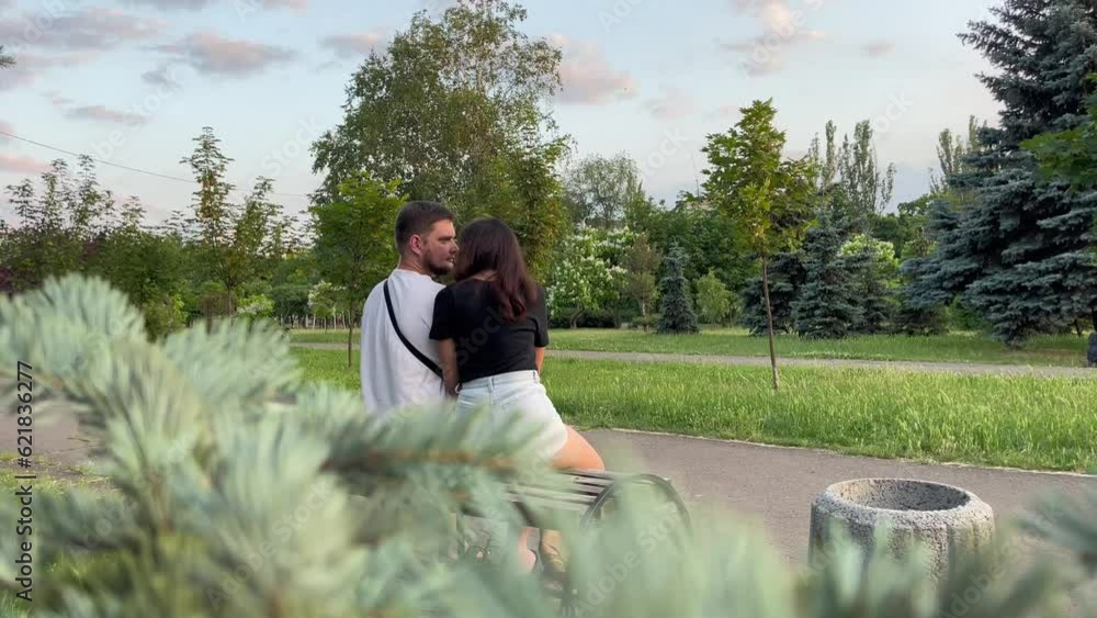 Man and woman sitting together in the park Man and woman sitting together in the park