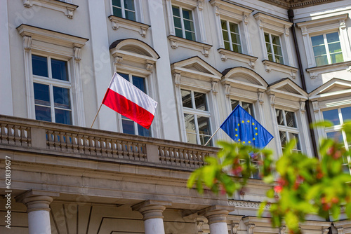 Polish national flag and flag of European Union on the building Jablonowski Palace in Warsaw, Poland