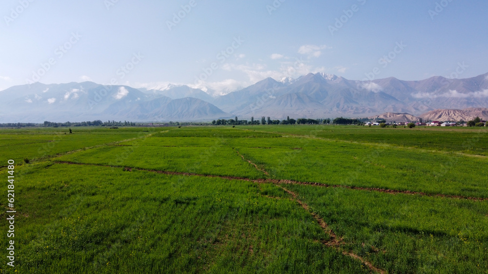 View of the mountains and the clearing in Kyrgyzstan, Kochkor, view from the top, aerial