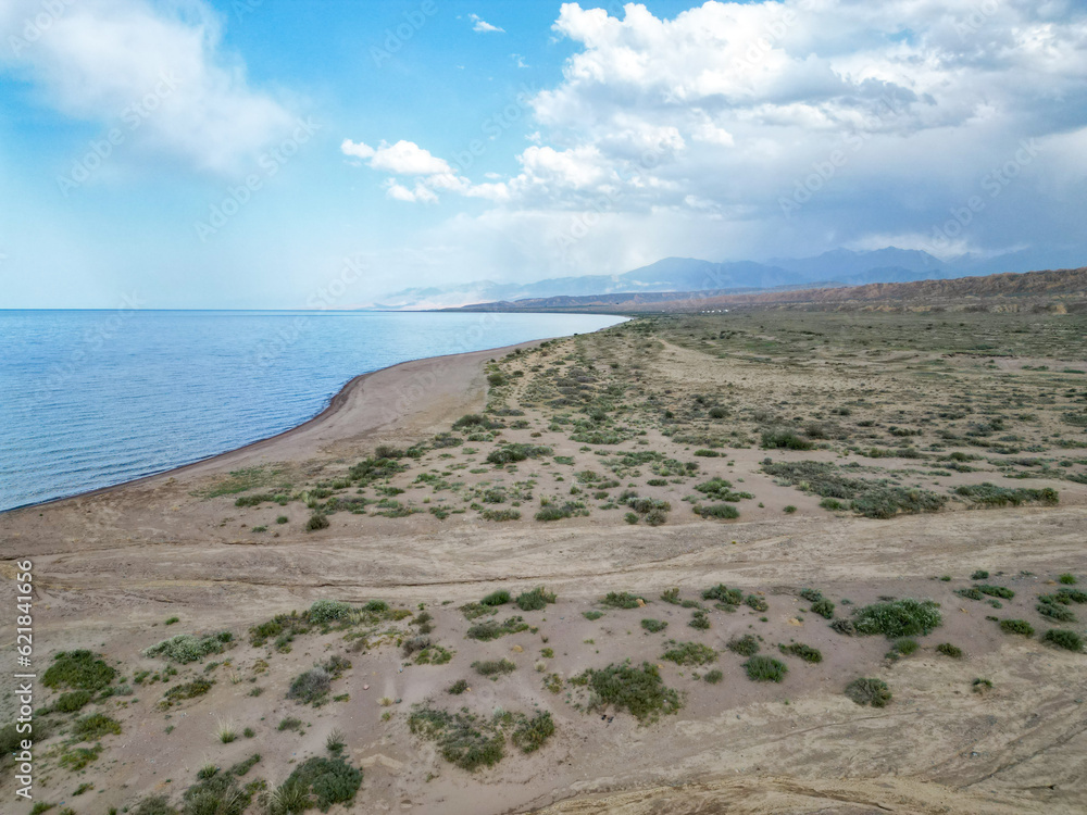 
View of sand castles, dunes and mountains from above, overlooking Issyk-Kul lake Ak-Sai gorge in Kyrgyzstan