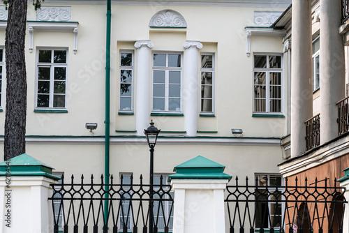 Fragment of the facade of a historic building on a summer day photo