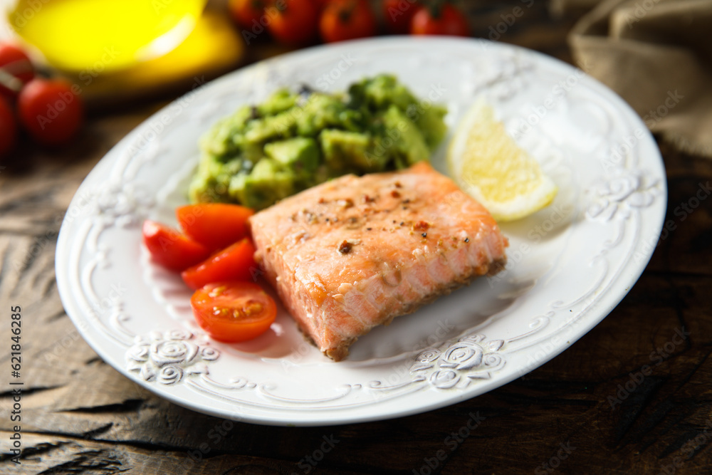 Healthy baked salmon fillet with mashed avocado Healthy baked salmon fillet with mashed avocado