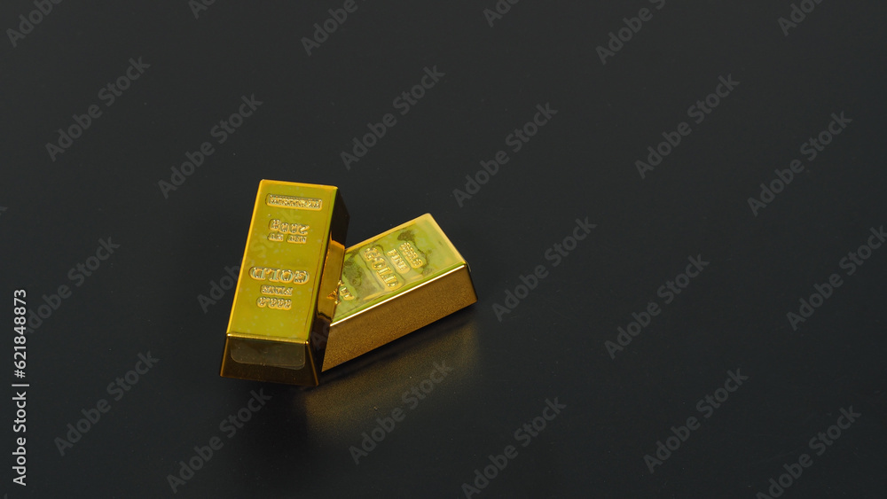 Two gold bars isolated on black background. Two gold bars isolated on black background.