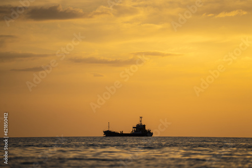 Ship in sea and sunset