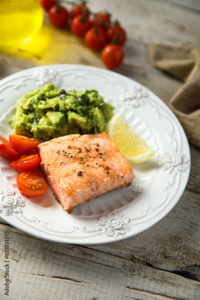 Healthy baked salmon fillet with mashed avocado Healthy baked salmon fillet with mashed avocado