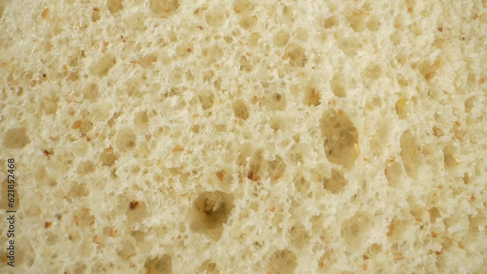 Indulge your senses with a captivating macro video featuring soft whole wheat bread. Get up close and personal with every grain, capturing the essence of its wholesome goodness. Bread background
Indulge your senses with a captivating macro video featuring soft whole wheat bread. Get up close and personal with every grain, capturing the essence of its wholesome goodness. Bread background