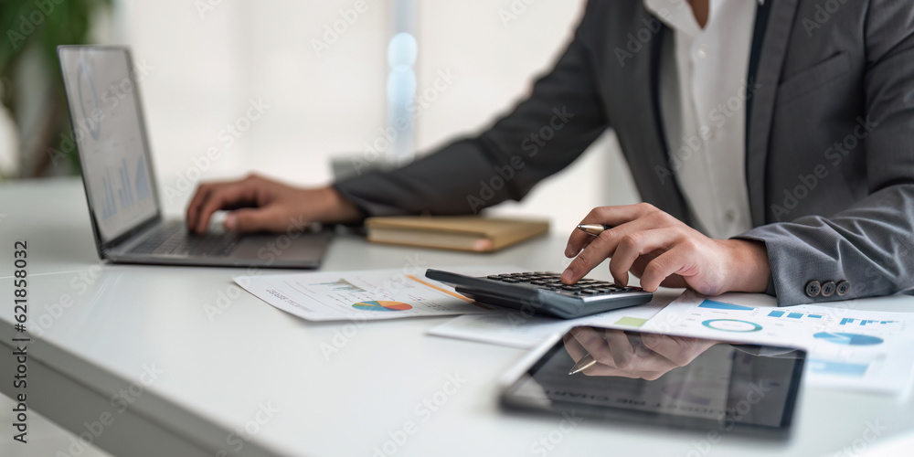 Young asian business man audit analysis graph company budget report, assigned accounts receivable, production control, operational audit, cost plus pricing