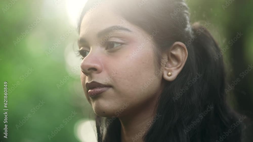 Close up portrait of smiling carefree indian woman feeling absolutely happy and satisfied enjoying great day at green city street Self confidence female open eyes and looking ahead feel proud outdoors Close up portrait of smiling carefree indian woman feeling absolutely happy and satisfied enjoying great day at green city street Self confidence female open eyes and looking ahead feel proud outdoors