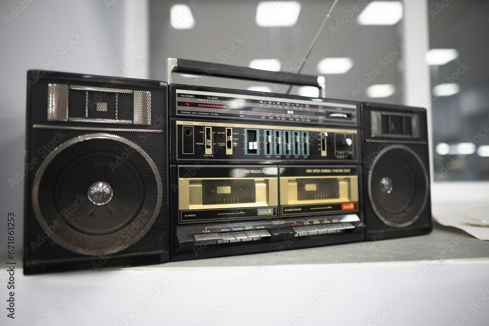 an old cassette recorder, a music center with a radio receiver - obrazy, fototapety, plakaty 
