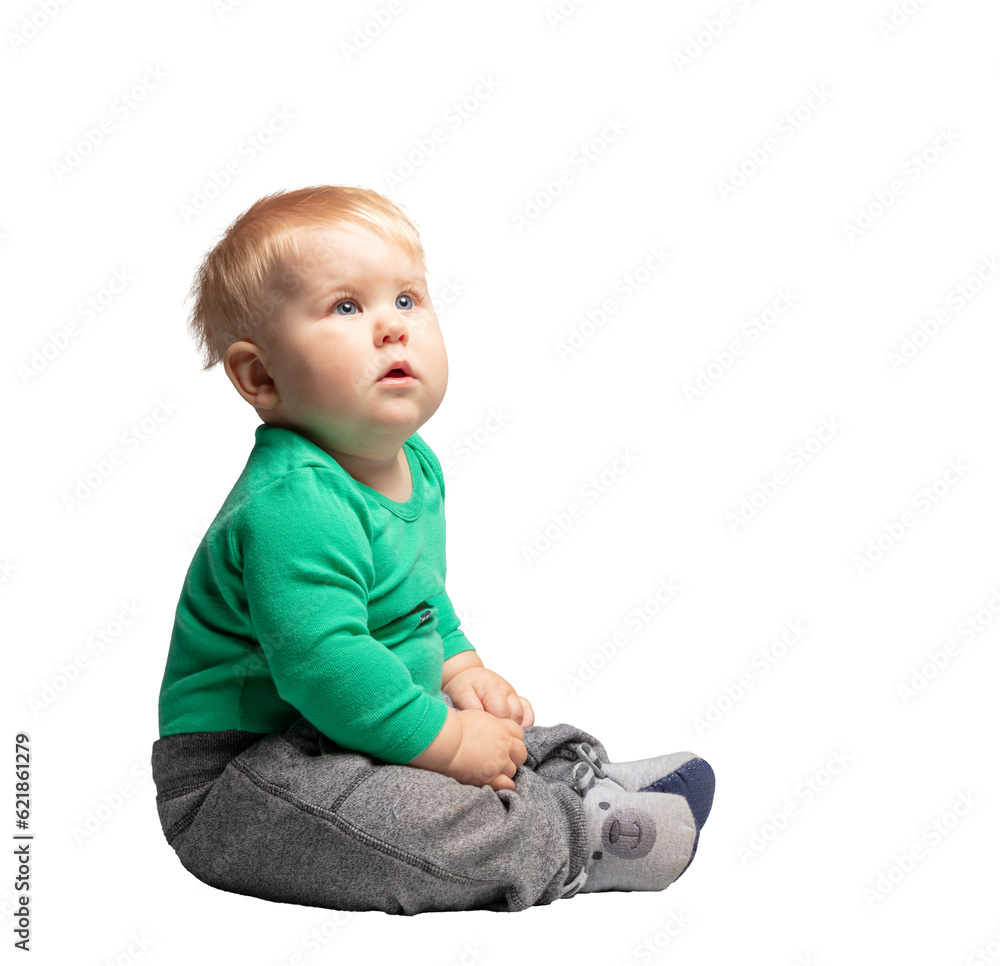 Toddler, a boy sitting and looking at copy space. Isolated on transparent white background Toddler, a boy sitting and looking at copy space. Isolated on transparent white background