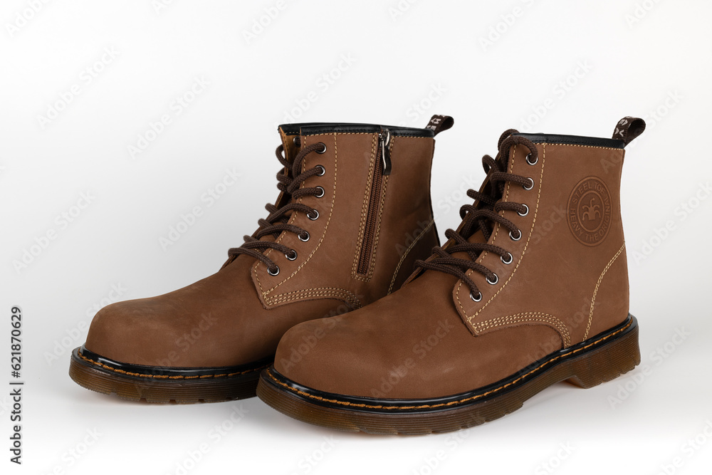 BANGKOK, THAILAND - July 10, 2023 : Close-up HEAVY Safety Shoes isolated on White Background. Genuine leather shoes with steel toe caps for protection. Illustrative Editorial. BANGKOK, THAILAND - July 10, 2023 : Close-up HEAVY Safety Shoes isolated on White Background. Genuine leather shoes with steel toe caps for protection. Illustrative Editorial.