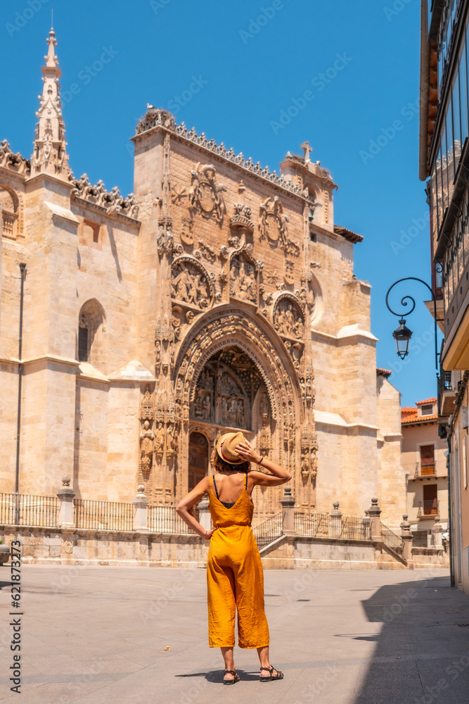 Woman from behind visiting the church of Santa María la Real in Aranda de Duero in the province of Burgos. Spain