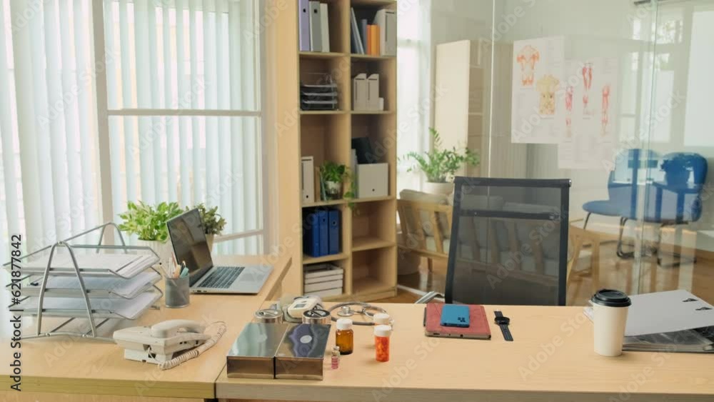 Wide shot of doctors workplace with piils, laptop, smartphone, smartwatch and coffee at desk Wide shot of doctors workplace with piils, laptop, smartphone, smartwatch and coffee at desk