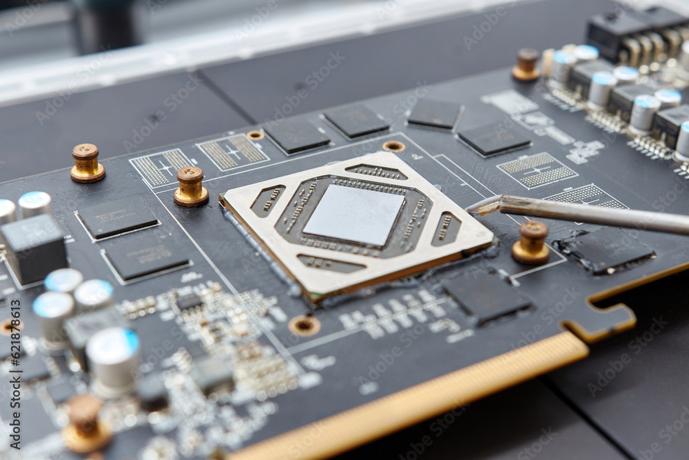 Infrared soldering station setup and GPU chip desoldering process. Maintenance and repair of computer equipment.