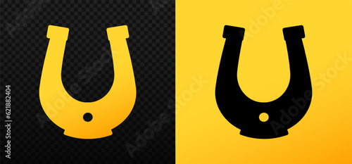 Gold and black horseshoe. Fortune talisman of good luck