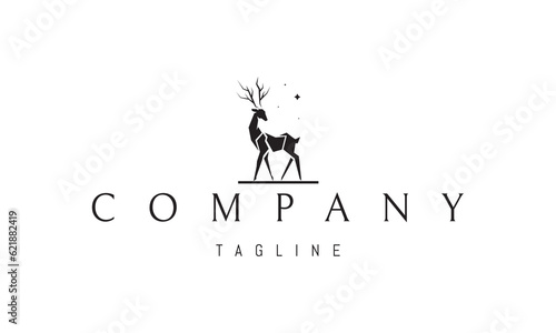Vector logo on which an abstract image of a deer on a background of stars.