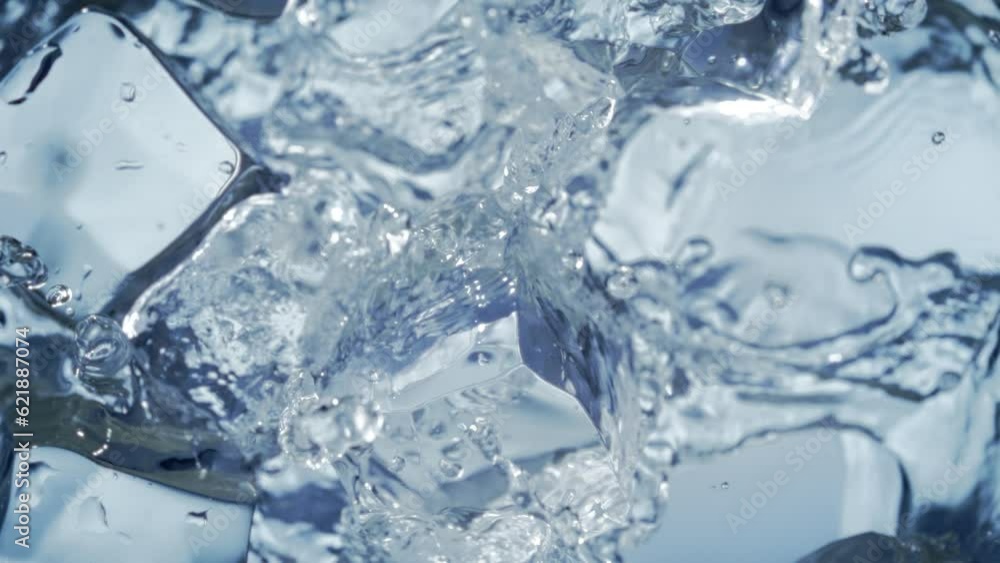 Super Slow Motion Shot of Falling and Splashing Perfect Ice Cubes into Water at 1000fps. Super Slow Motion Shot of Falling and Splashing Perfect Ice Cubes into Water at 1000fps.