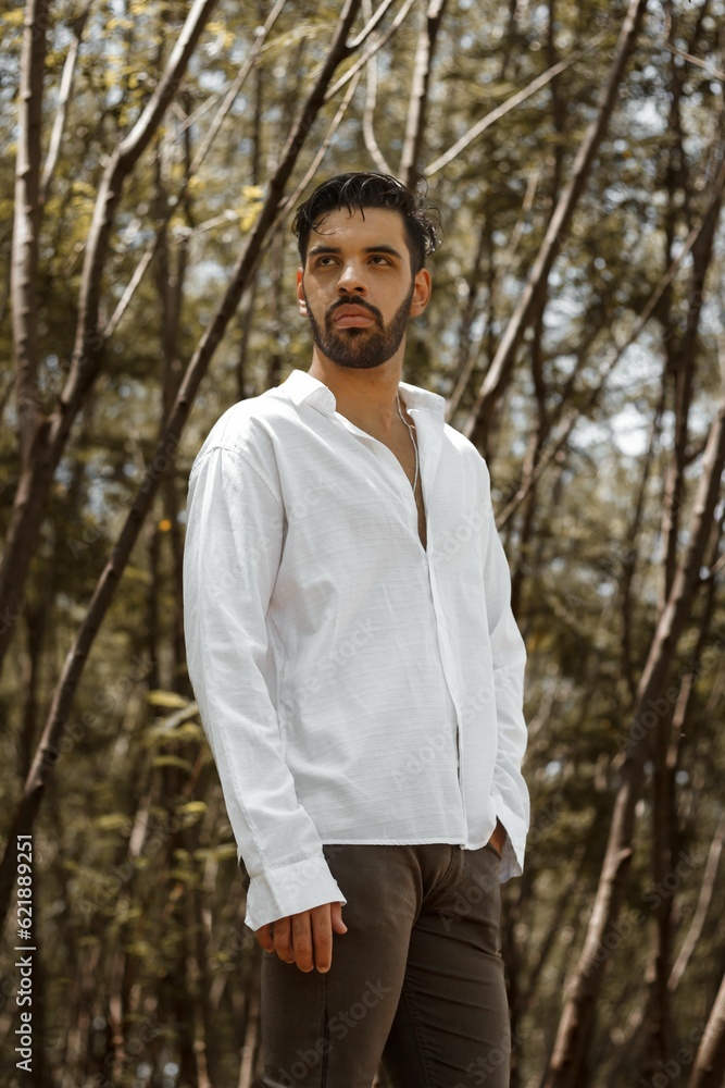 handsome young man with a beard, handsome young man with a beard wearing a white jacket in the middle of a forest handsome young man with a beard, handsome young man with a beard wearing a white jacket in the middle of a forest
