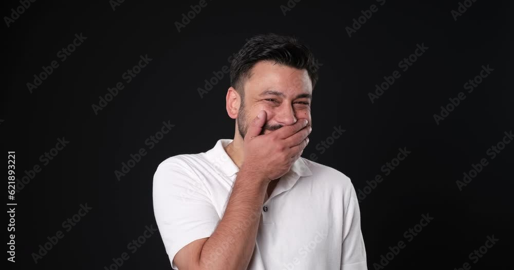 The when a middle-aged man in a studio setting, through close-up shots, looks at the camera and makes facial expressions that show his excitement after receiving a compliment The when a middle-aged man in a studio setting, through close-up shots, looks at the camera and makes facial expressions that show his excitement after receiving a compliment