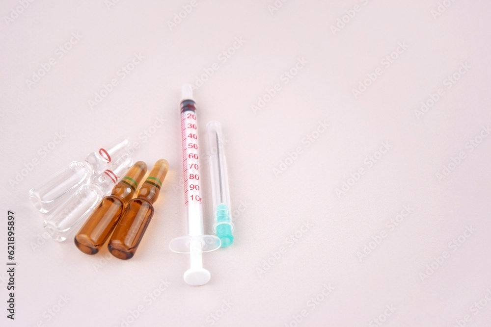 Many medical ampoule on light background. Medicines concept.