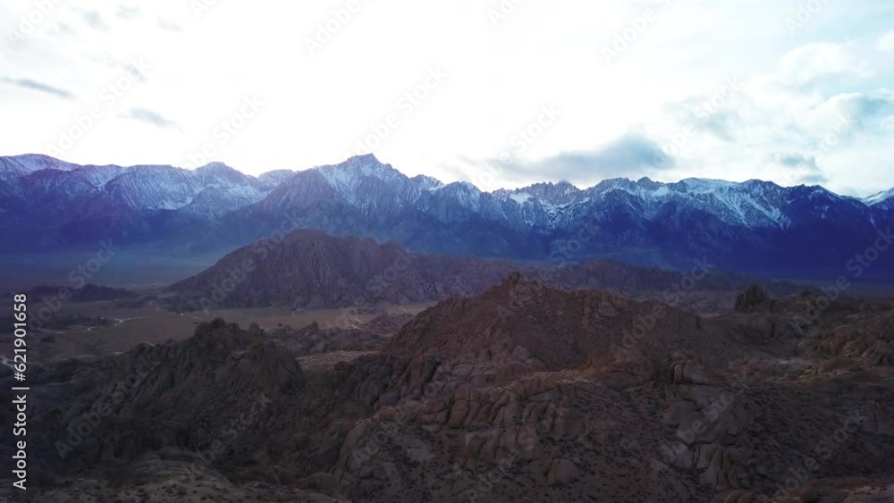 Aerial Forward Shot Of Scenic Rocky Landscape Against Sky, Drone Flying Over Rock Formations During Sunset - Alabama Hills, California
