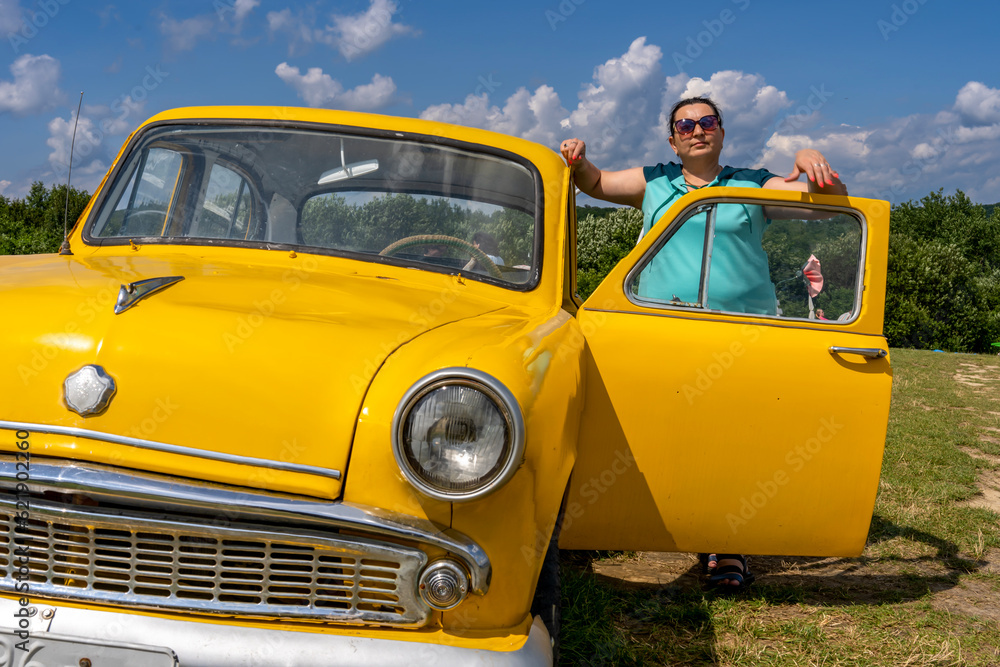 woman with yellow retro car