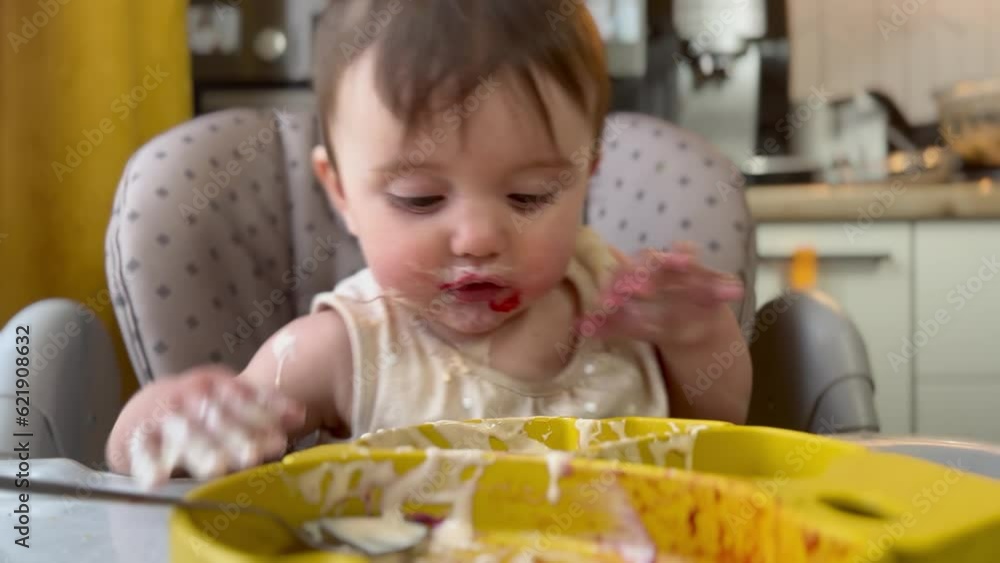 baby girl eats dirty. happy family kid a dream concept. baby funny got