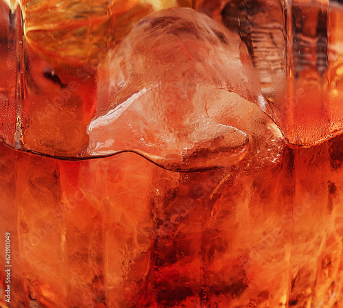 Obraz na płótnie Dark orange drink in glass close up
