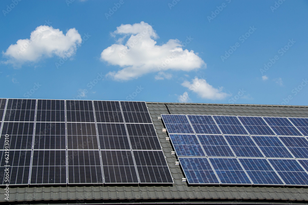 House roof with photovoltaic modules. House roof with photovoltaic modules.