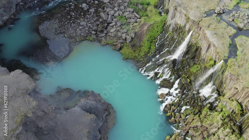 Aerial view of Sigoldugljufur canyon with river and waterfall on mountain crests, Iceland. photo