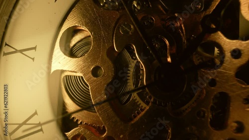 Macro mechanical vintage watch. Arrow, gears rapidly rotating. Time running fast
