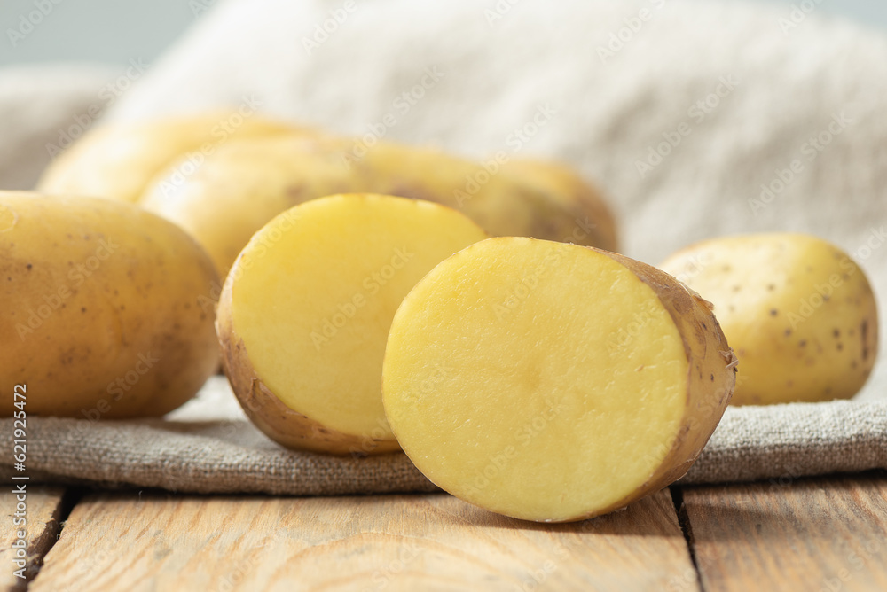 Close-up cut of a fresh ripe potato tuber.