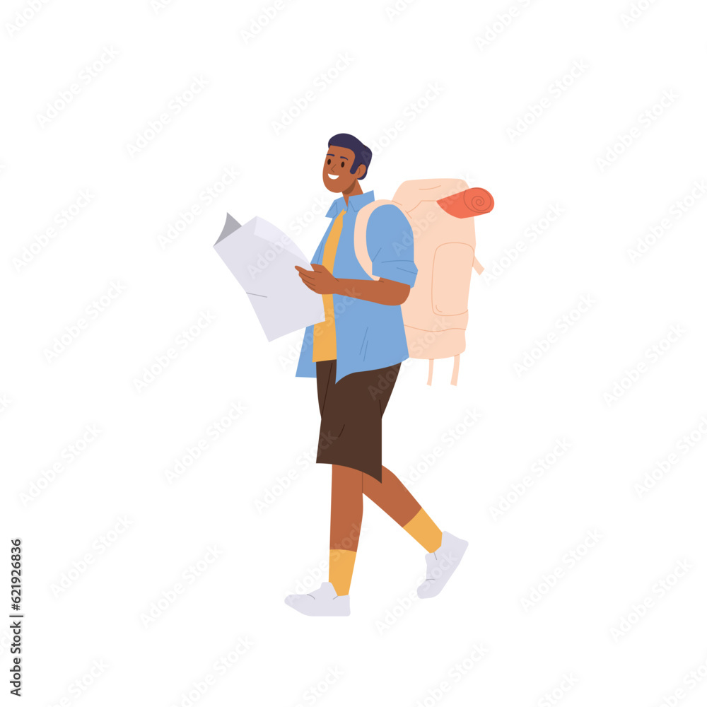 Smiling young man traveler with backpack holding paper map walking isolated on white background Smiling young man traveler with backpack holding paper map walking isolated on white background