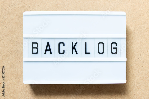 Lightbox with word backlog on wood background photo