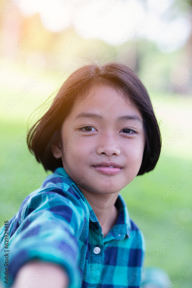 Close up of girls smiling face.Summertime, golden hour, sunset. SSTKHome Close up of girls smiling face.Summertime, golden hour, sunset. SSTKHome