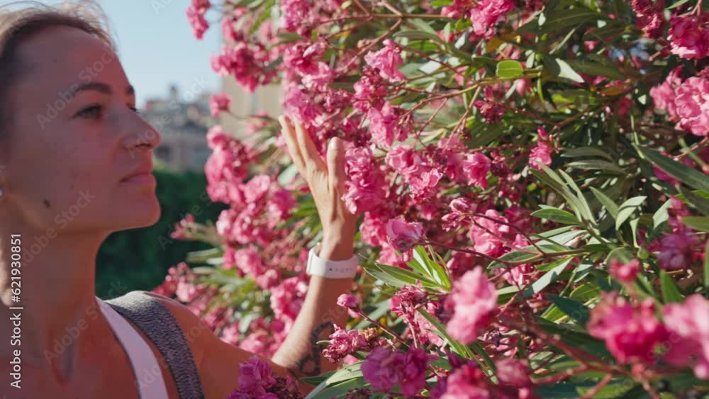 A young girl enjoys the morning going to training among the flowers. Concept of a cheerful person doing yoga. . High quality 4k footage A young girl enjoys the morning going to training among the flowers. Concept of a cheerful person doing yoga. . High quality 4k footage