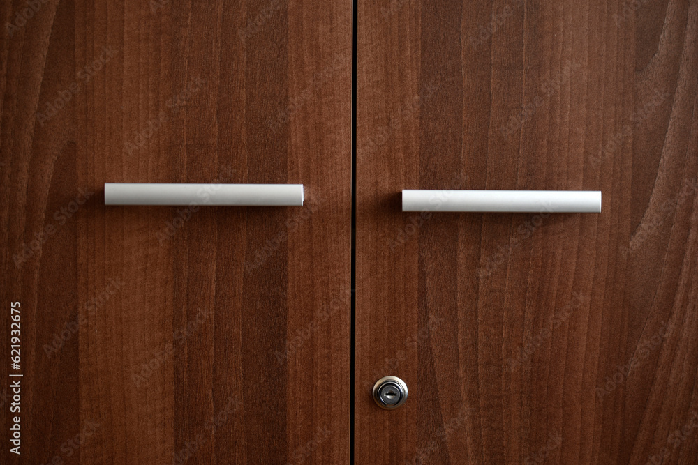 Obraz premium Office furniture. A brown box for documents. The handles are at the old drawer.