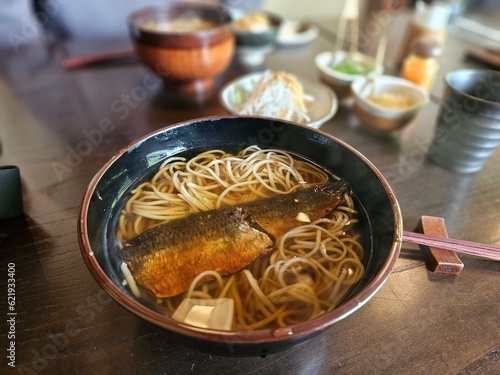 Japanese noodle soup with fish photo